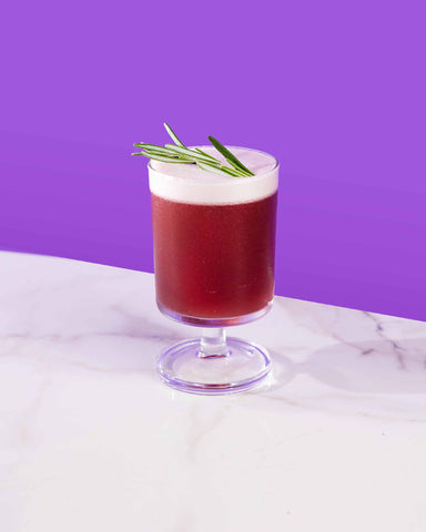 Non-alcoholic Amaretto sour  and rosemary with NOA Amaretto and Blueberry Syrup